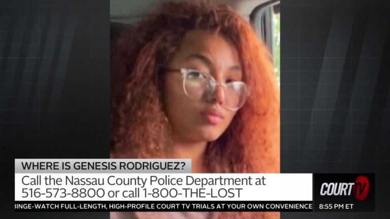 teen girl with red curly hair and glasses with clear plastic frames.
